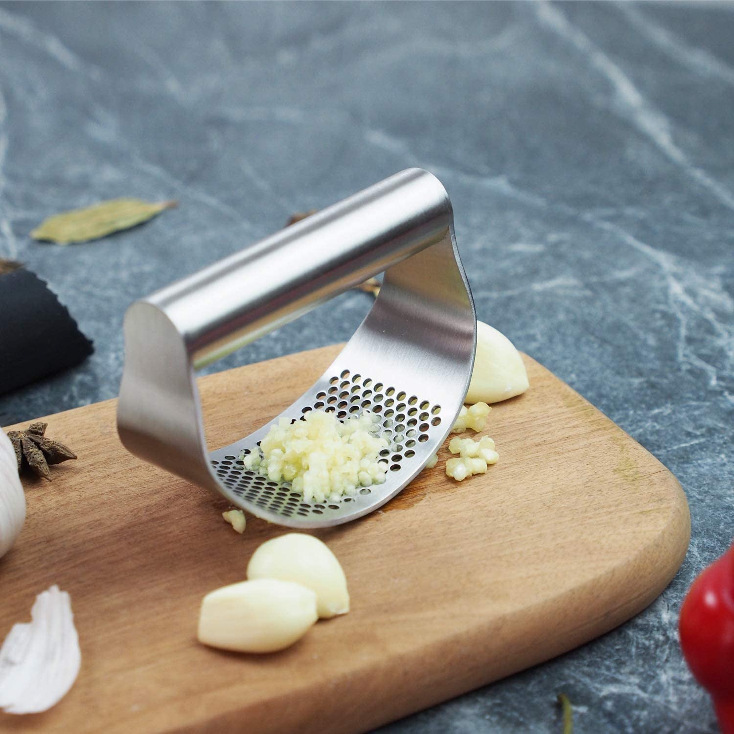 Stainless Steel Garlic Press and Mincer with Peeler, Scraper Brush, and Ergonomic Handle - Innovative Kitchen Gadget