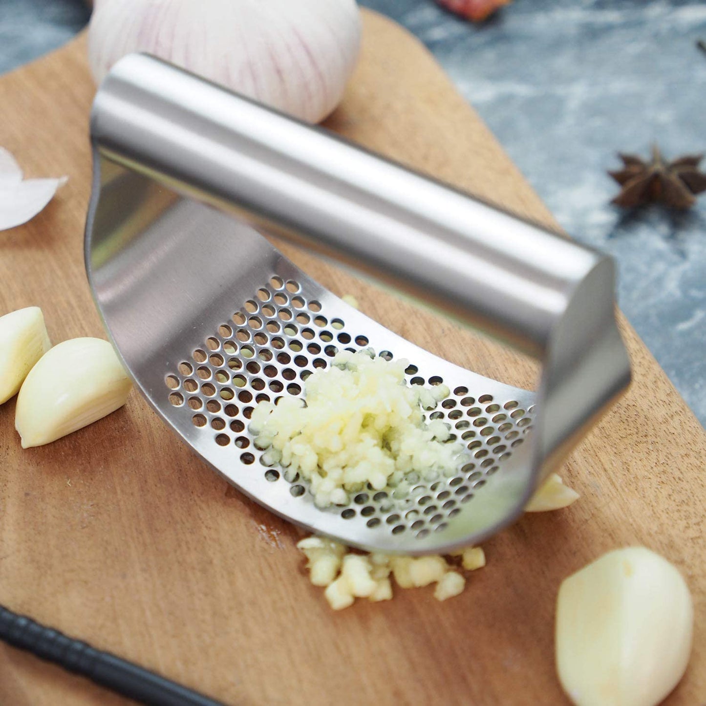 Stainless Steel Garlic Press and Mincer with Peeler, Scraper Brush, and Ergonomic Handle - Innovative Kitchen Gadget